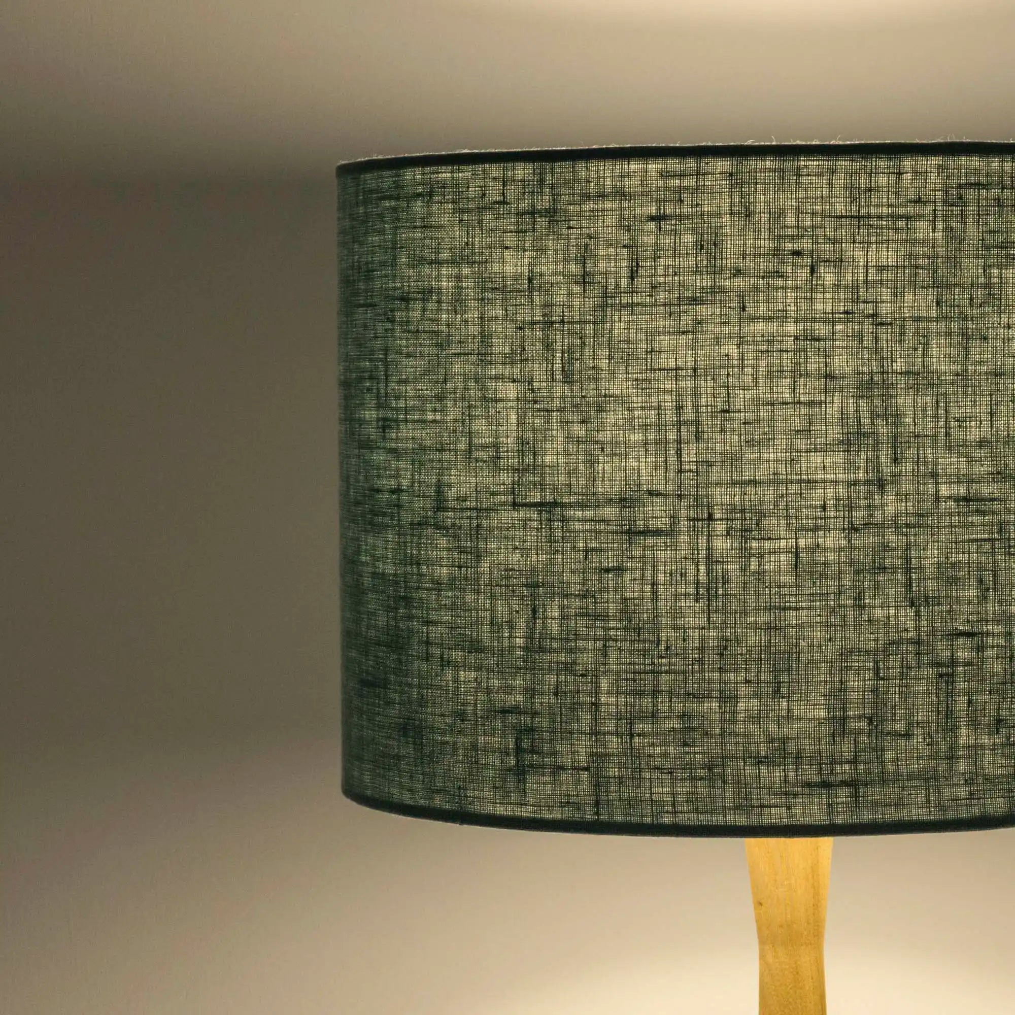Dusty turquoise lampshade in textured linen illuminated