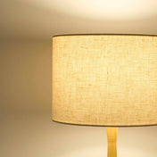 Cream lampshade in textured linen illuminated
