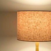 Dusty pink lampshade in textured linen illuminated