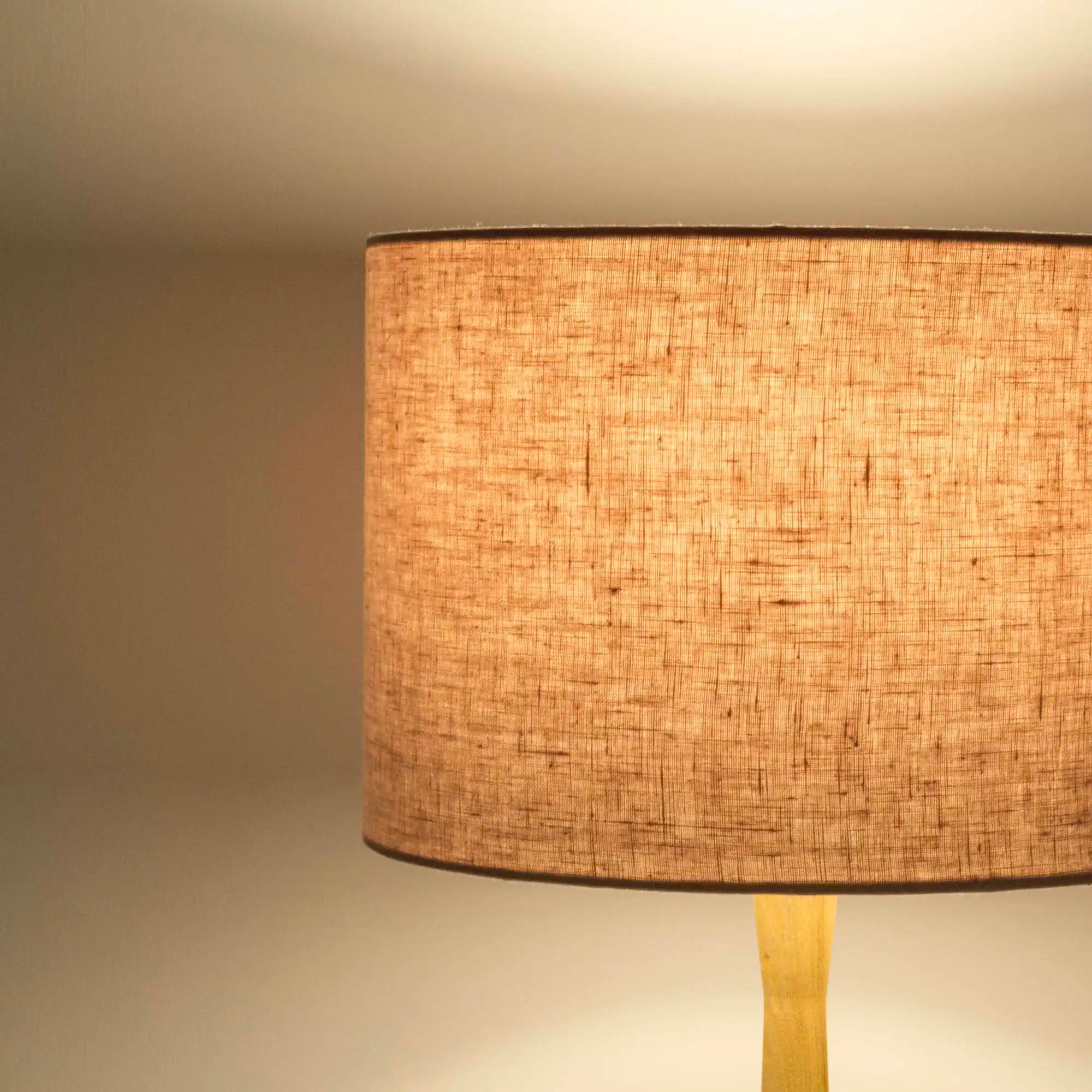 Dusty pink lampshade in textured linen illuminated