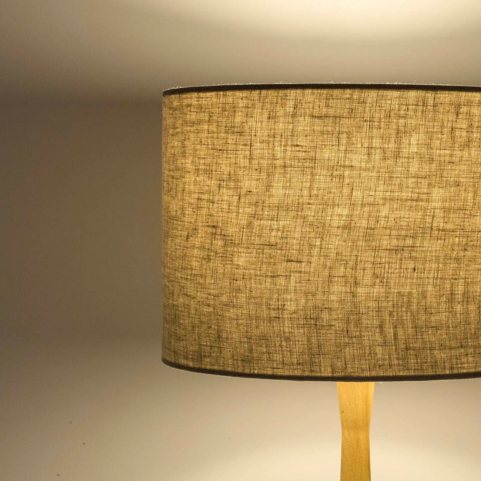 Natural linen lampshade in textured linen illuminated