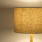 Oatmeal lampshade in textured linen illuminated