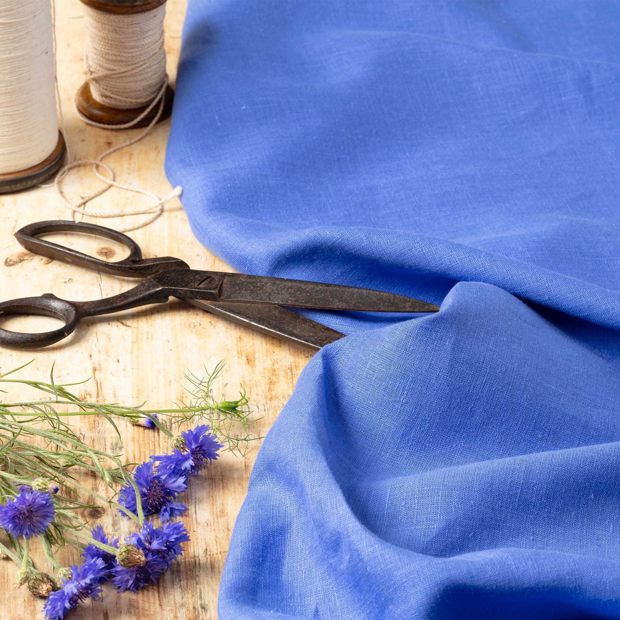 Cornflower_Blue_Linen_Fabric_Wooden_Cutting_Table.jpg