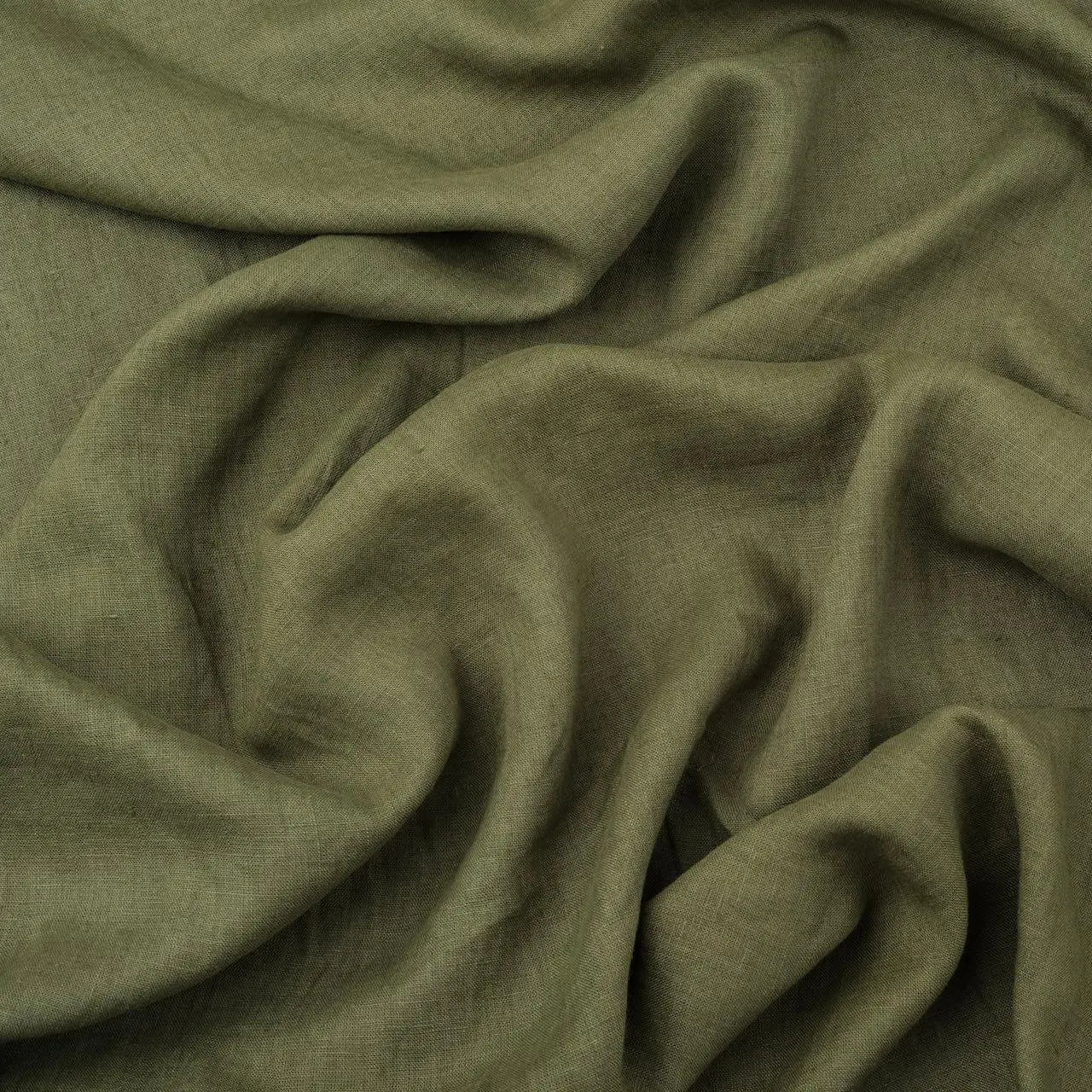 Olive Green linen fabric, crumpled to show its natural texture, washed European flax