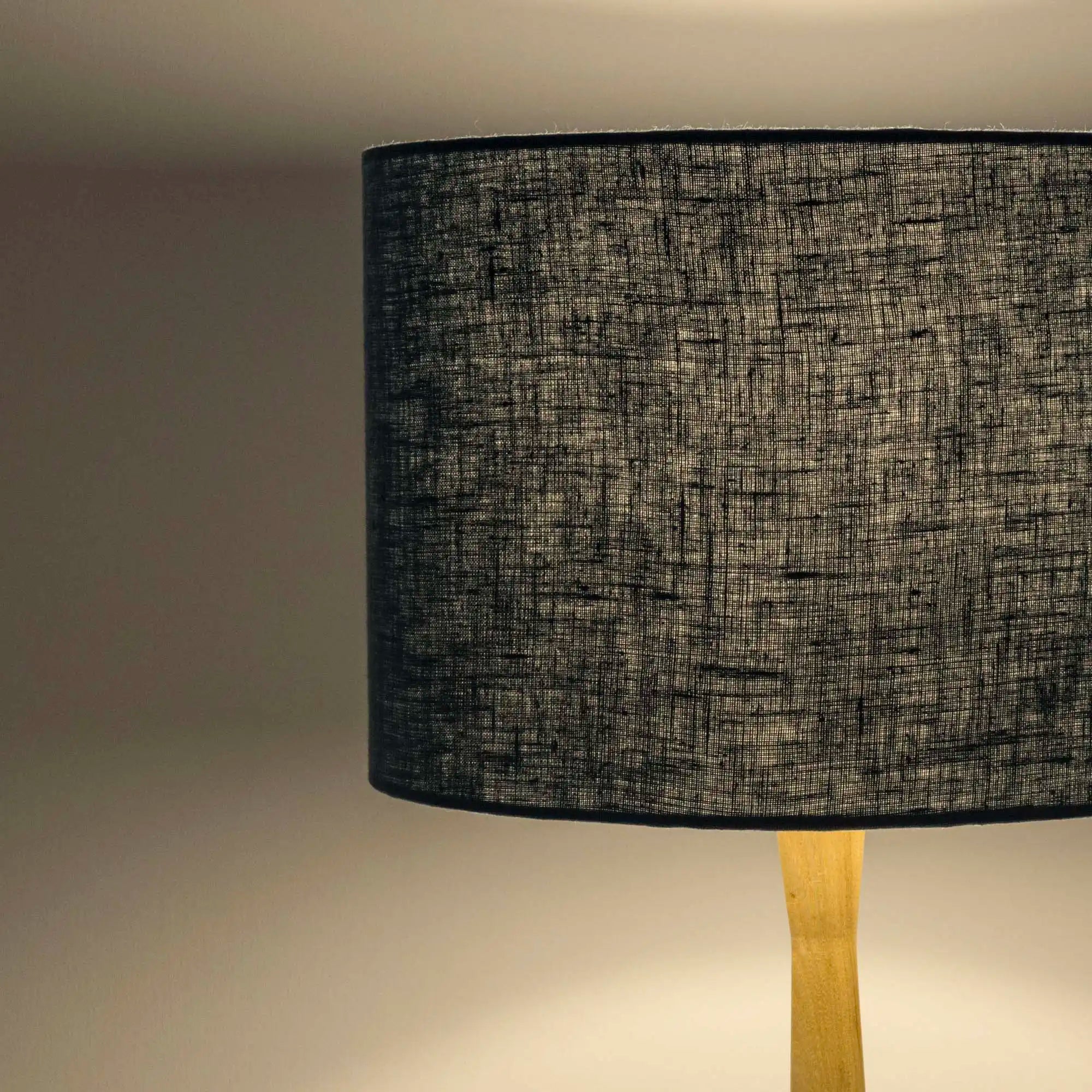 Dusty blue lampshade in textured linen illuminated 