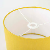 Honey yellow linen lampshades fitting and frame close up