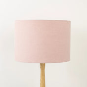 Light dusty pink lampshade made from textured linen on wooden stand