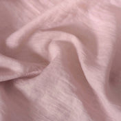 Light Dusty Pink linen fabric, crumpled to show its natural texture, washed European flax