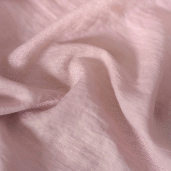 Light Dusty Pink linen fabric, crumpled to show its natural texture, washed European flax