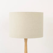 Oatmeal lampshade made from textured linen on wooden stand