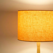 Peach lampshade in textured linen illuminated 