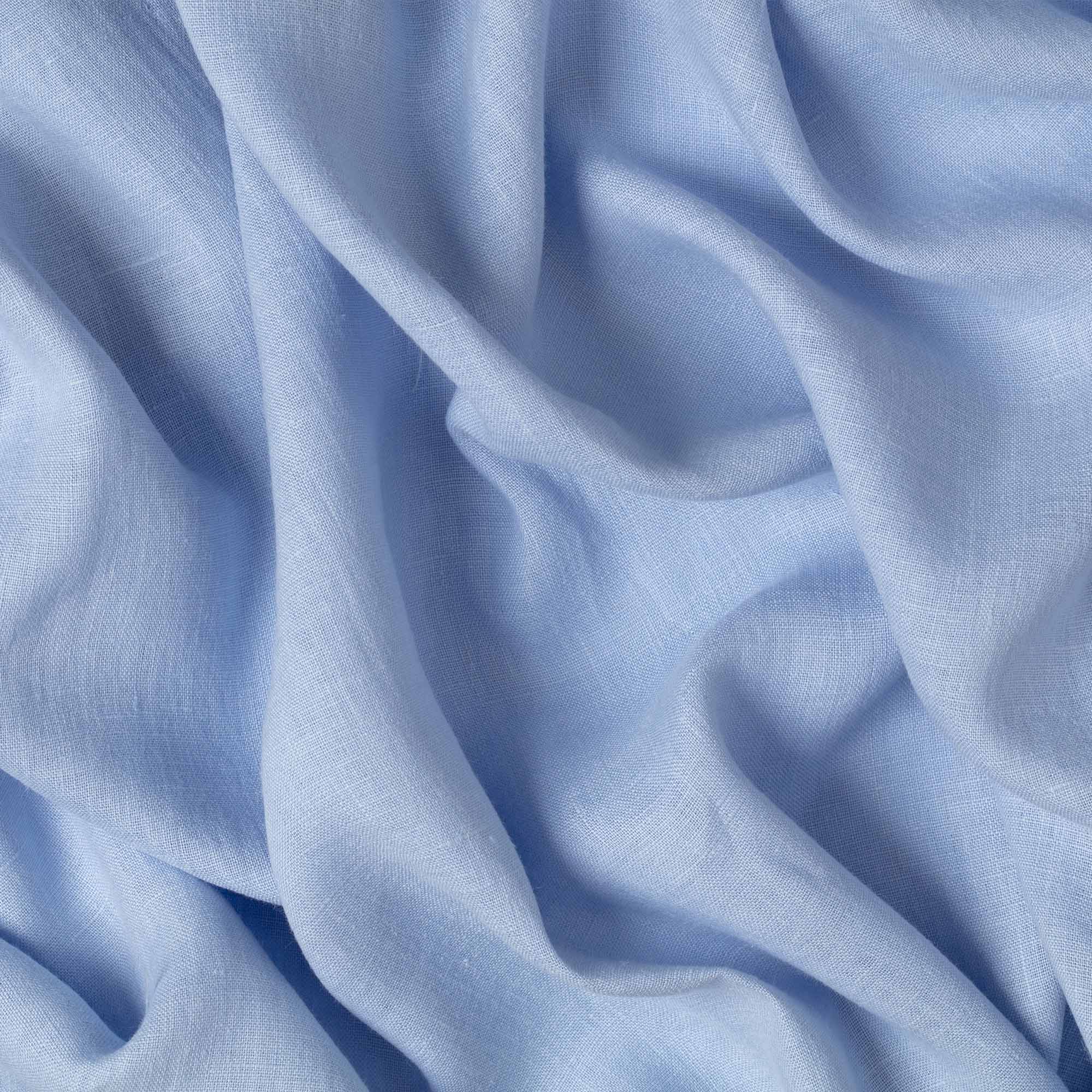 Powder Blue linen fabric, crumpled to show its natural texture, washed European flax