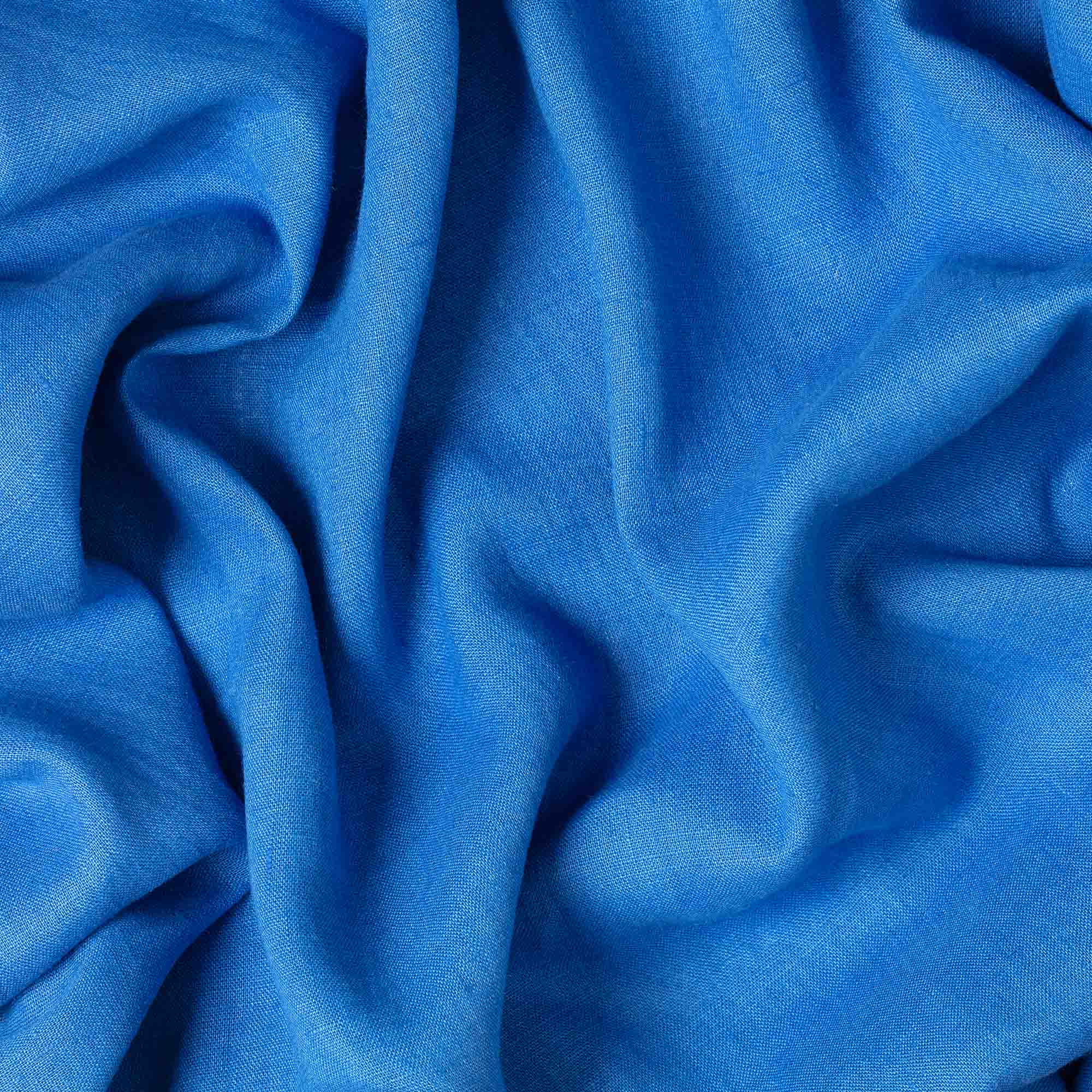 Sapphire Blue linen fabric, crumpled to show its natural texture, washed European flax