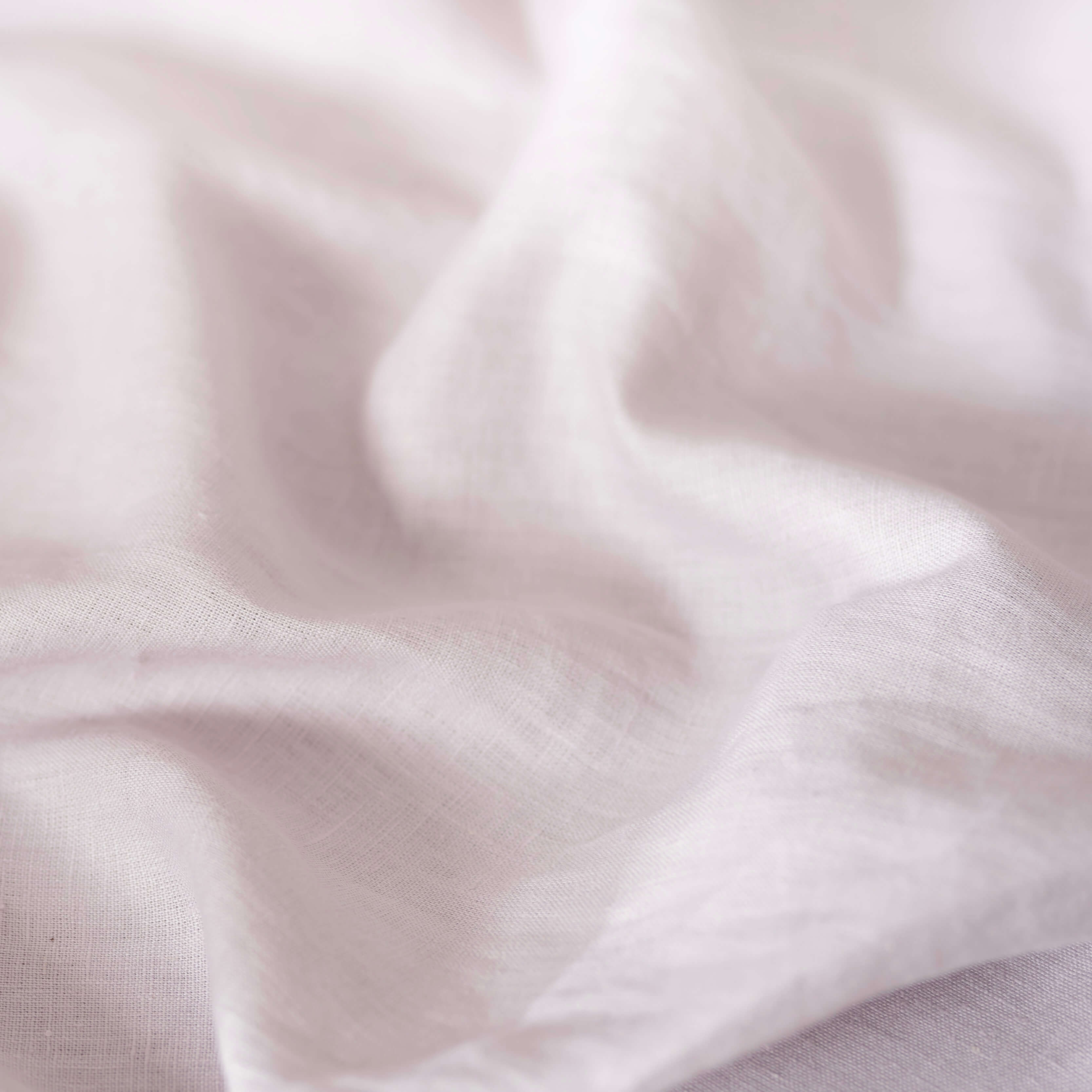Coconut Milk linen fabric, crumpled to show its natural texture, washed European flax