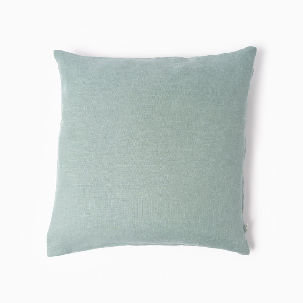 Dusty turquoise linen cushion cover on white background