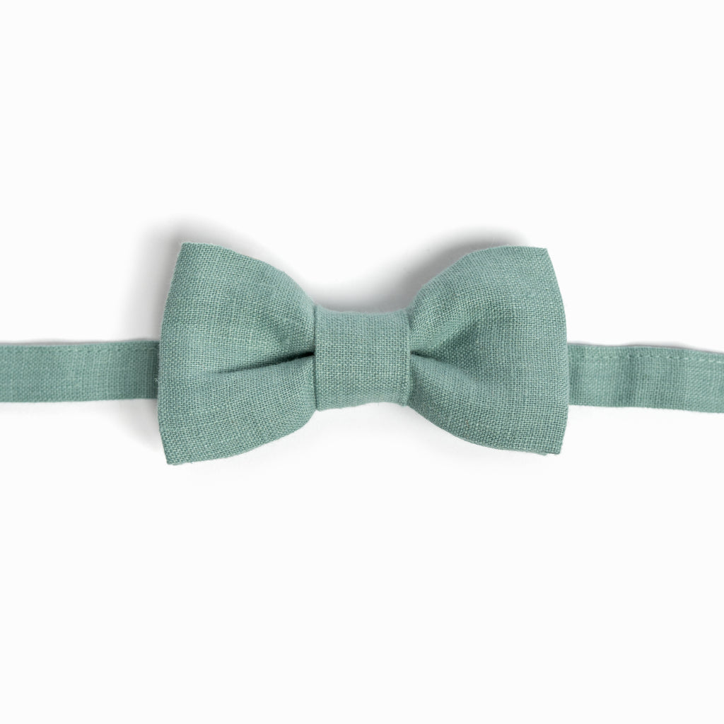 Dusty turquoise linen bow tie on white background