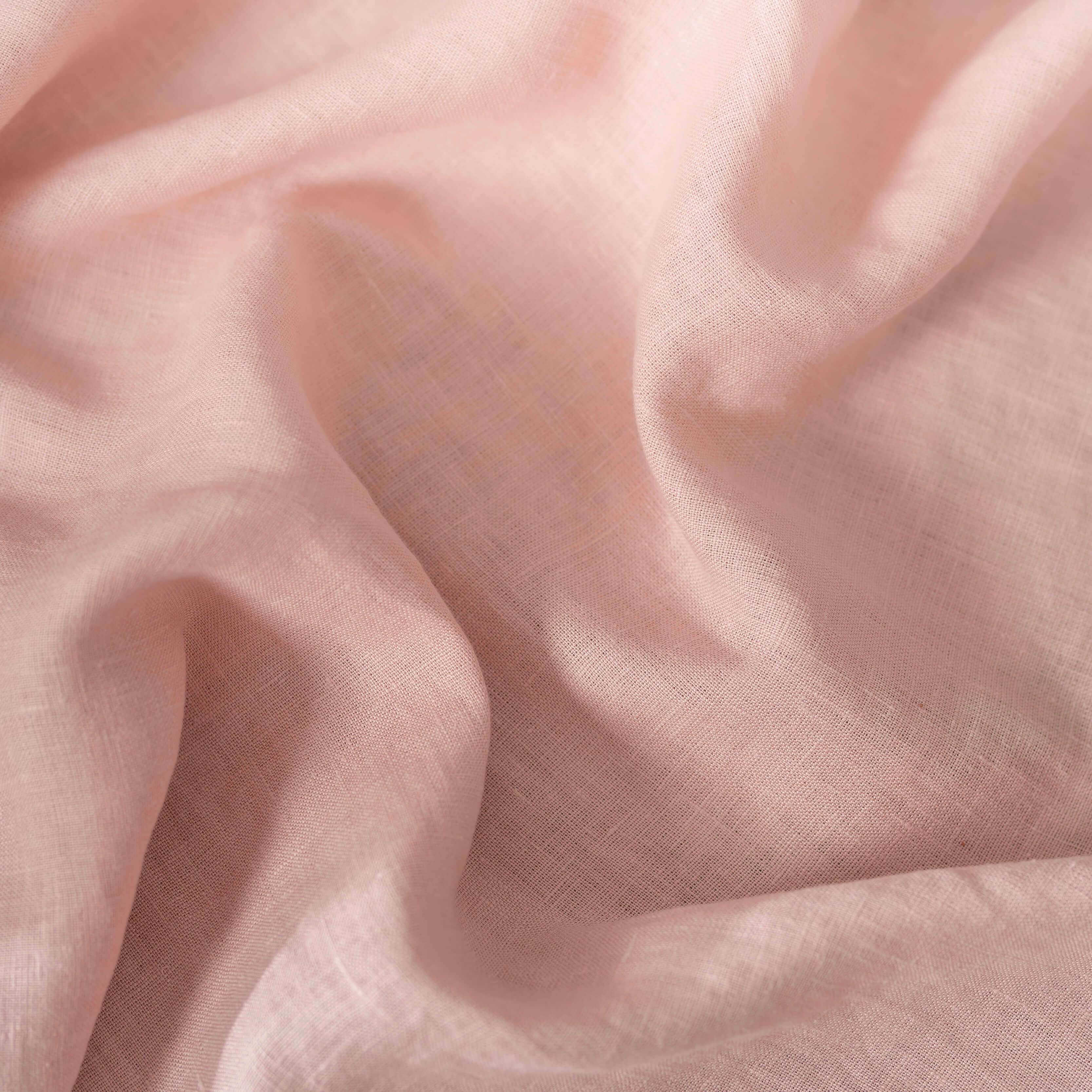 Blush Pink linen fabric, crumpled to show its natural texture, washed European flax