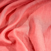 Coral Pink linen fabric, crumpled to show its natural texture, washed European flax
