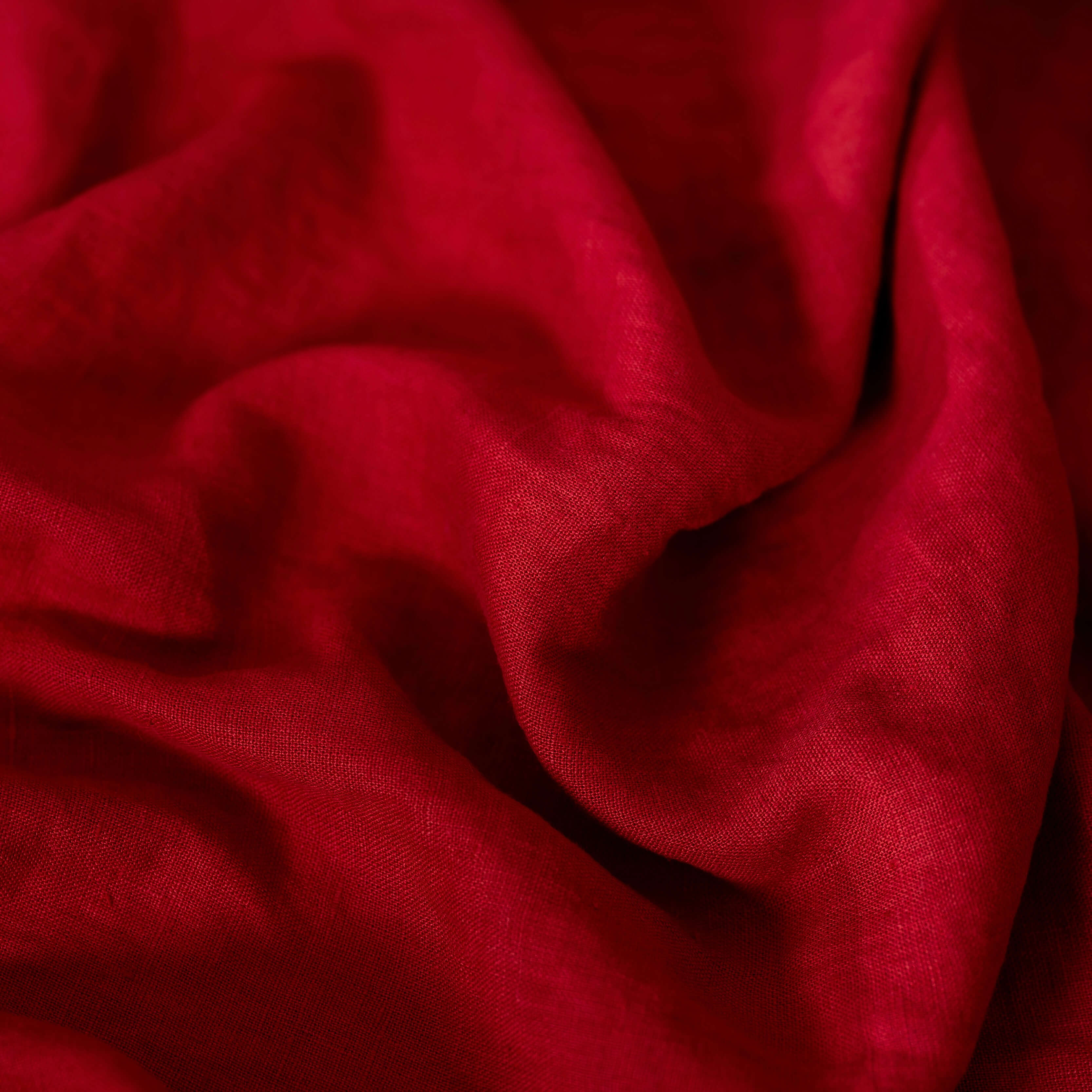 Berry Red linen fabric, crumpled to show its natural texture, washed European flax