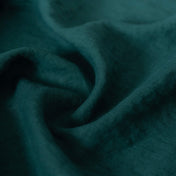 Dark Forest Green linen fabric, crumpled to show its natural texture, washed European flax