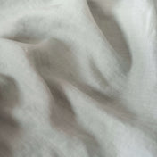 Dark Mint Green linen fabric, crumpled to show its natural texture, washed European flax