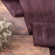 Dark Plum Purple linen fabric, ready to cut, with scissors, thread bobbins and flowers