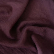 Dark Plum Purple linen fabric, crumpled to show its natural texture, washed European flax