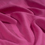 Fuchsia Pink linen fabric, crumpled to show its natural texture, washed European flax