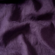 Grape Purple linen fabric, crumpled to show its natural texture, washed European flax