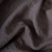 Graphite Grey linen fabric, crumpled to show its natural texture, washed European flax