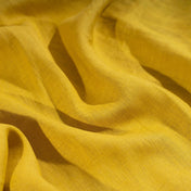 Honey Yellow linen fabric, crumpled to show its natural texture, washed European flax