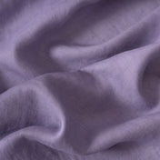 Lavender linen fabric, crumpled to show its natural texture, washed European flax