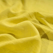 Lemon linen fabric, crumpled to show its natural texture, washed European flax
