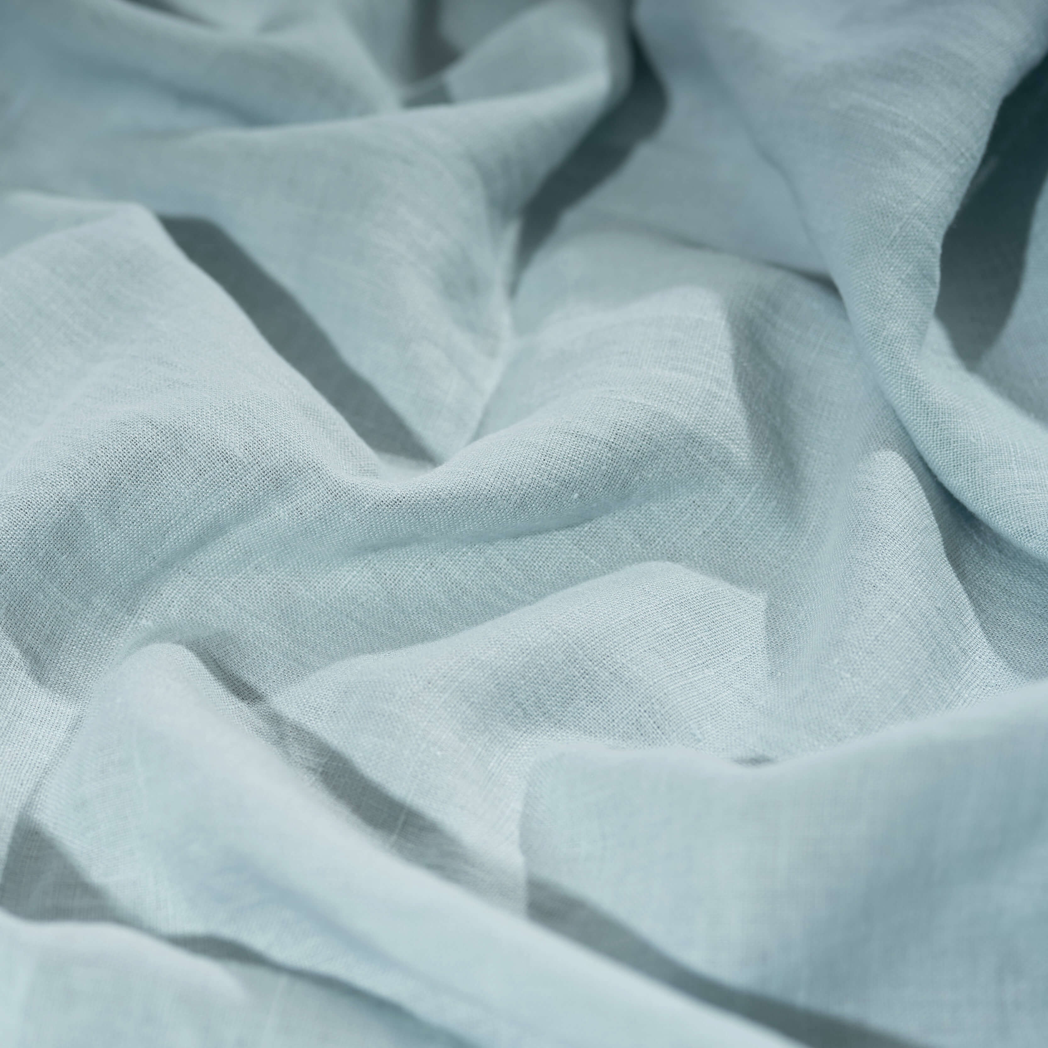Light Duck Egg Blue linen fabric, crumpled to show its natural texture, washed European flax