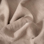 Natural linen fabric, crumpled to show its natural texture, washed European flax