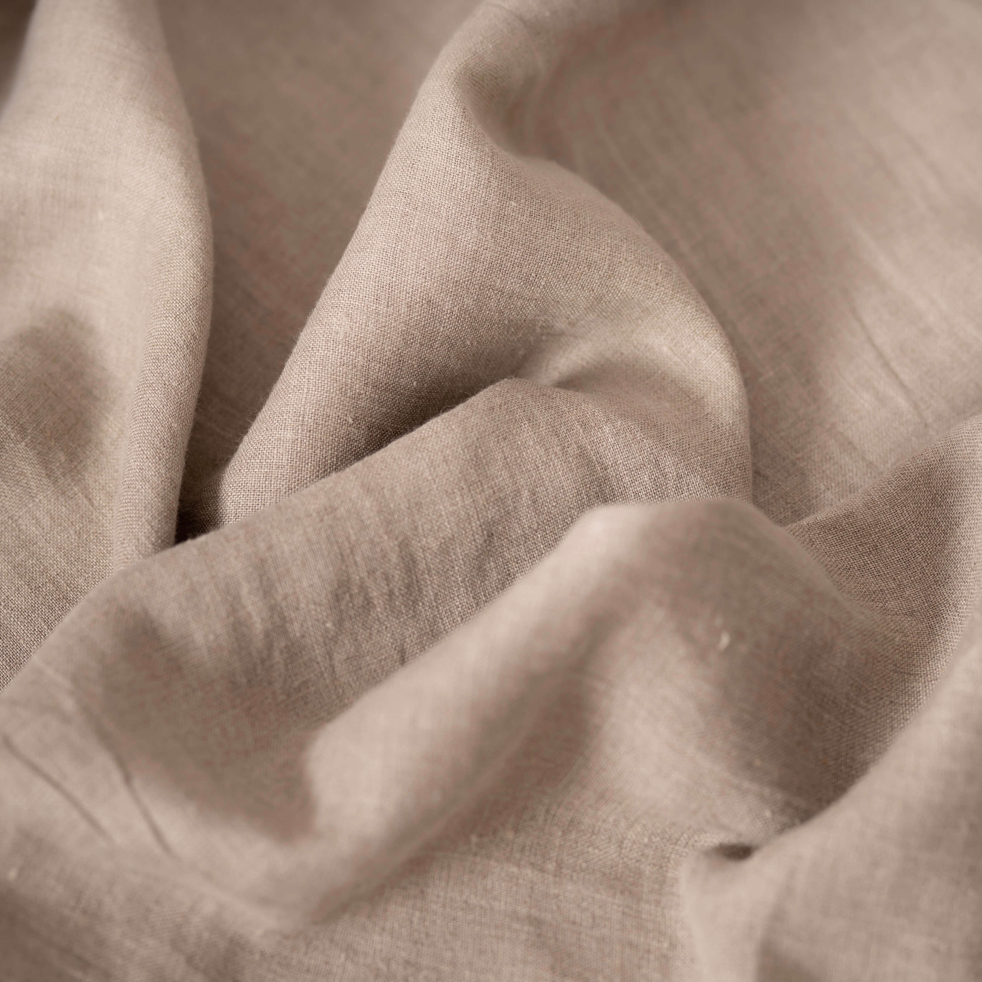 Natural linen fabric, crumpled to show its natural texture, washed European flax