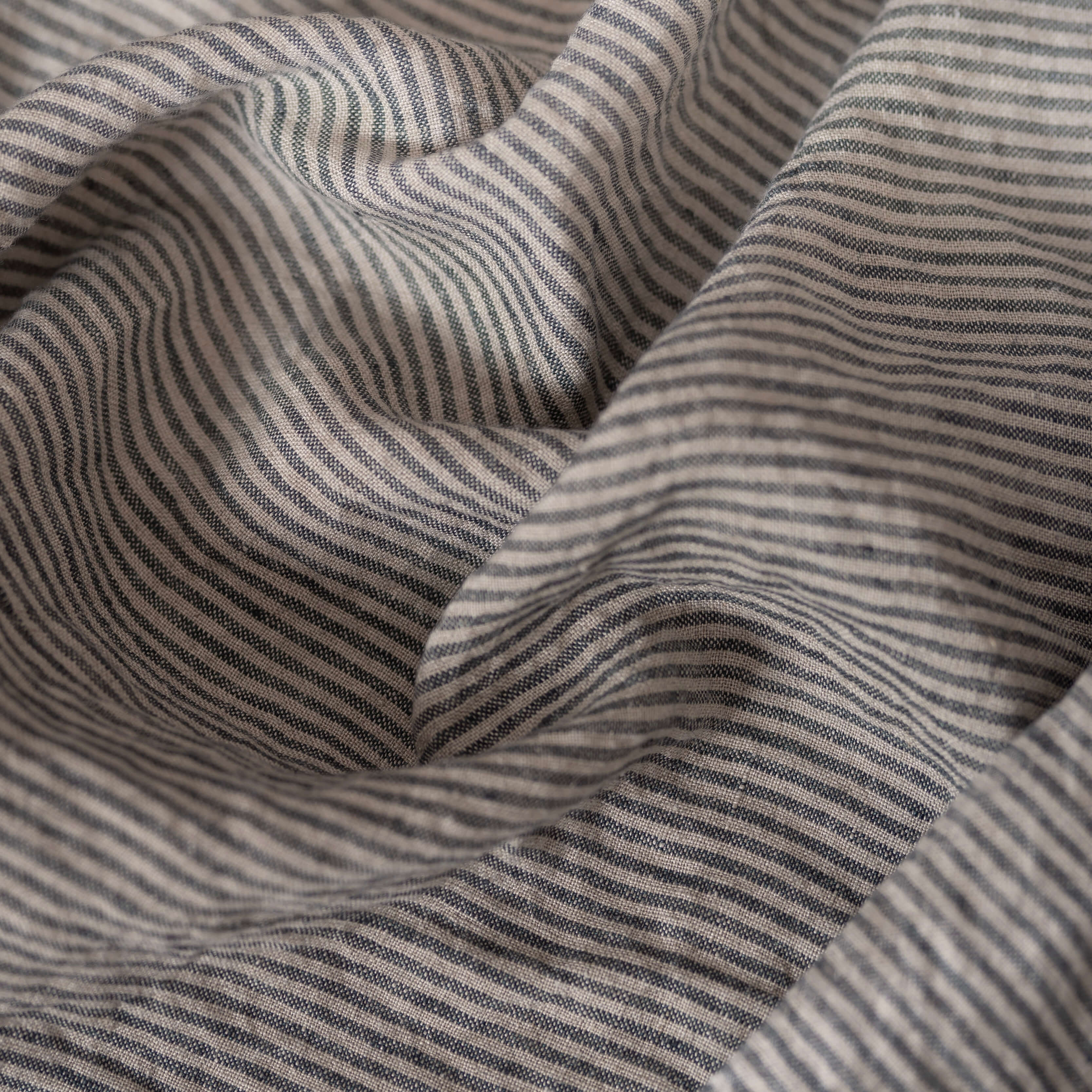 Natural & Grey Stripes linen fabric, crumpled to show its natural texture, washed European flax