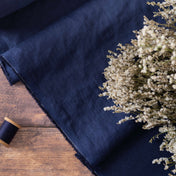 Navy Blue linen fabric, ready to cut, with thread bobbins and flowers