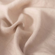 Oatmeal linen fabric, crumpled to show its natural texture, washed European flax
