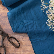 Petrol Blue linen fabric, ready to cut, with scissors and flowers