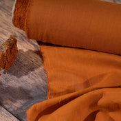 Pumpkin Orange linen fabric, ready to cut , on wooden table with flower