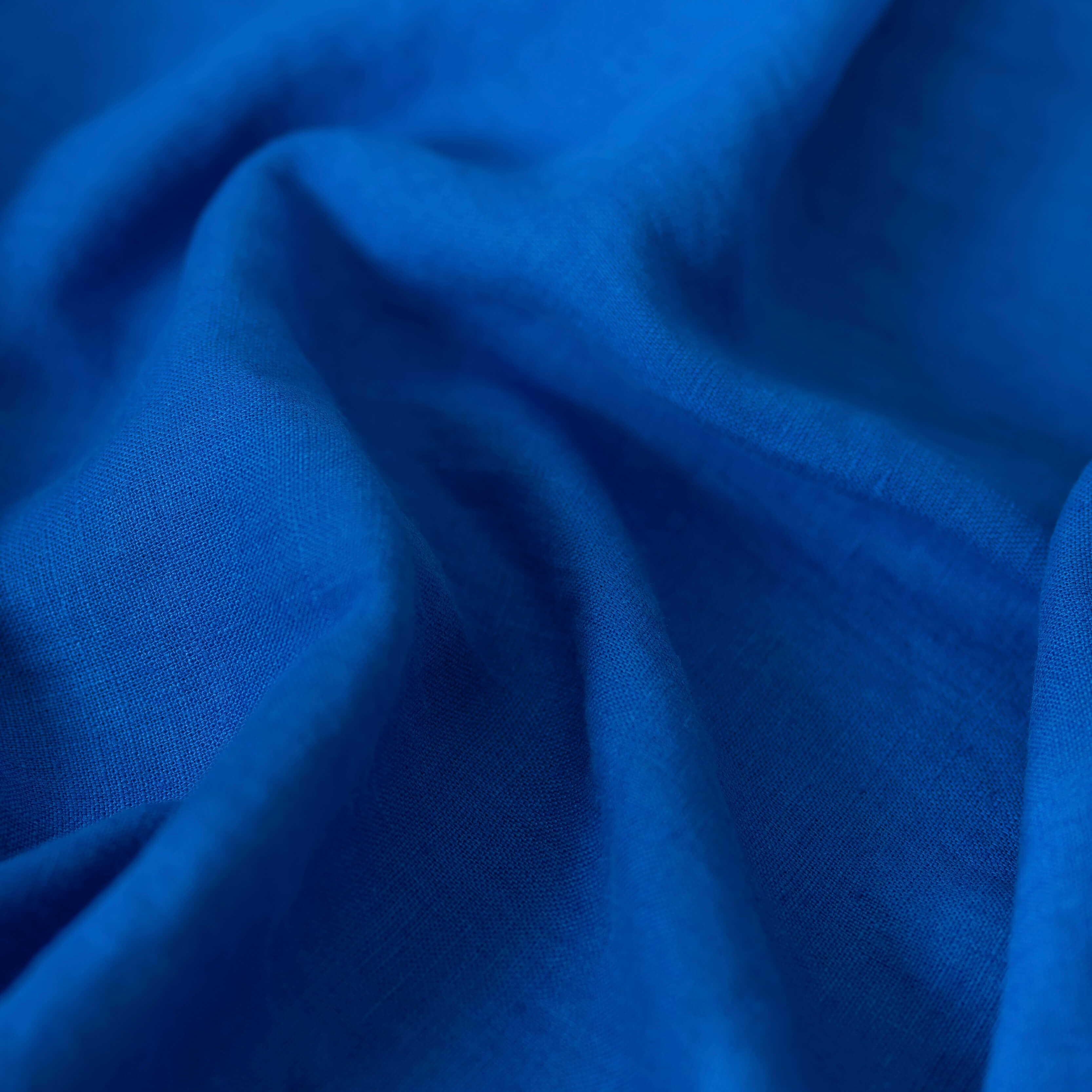 Royal Blue linen fabric, crumpled to show its natural texture, washed European flax