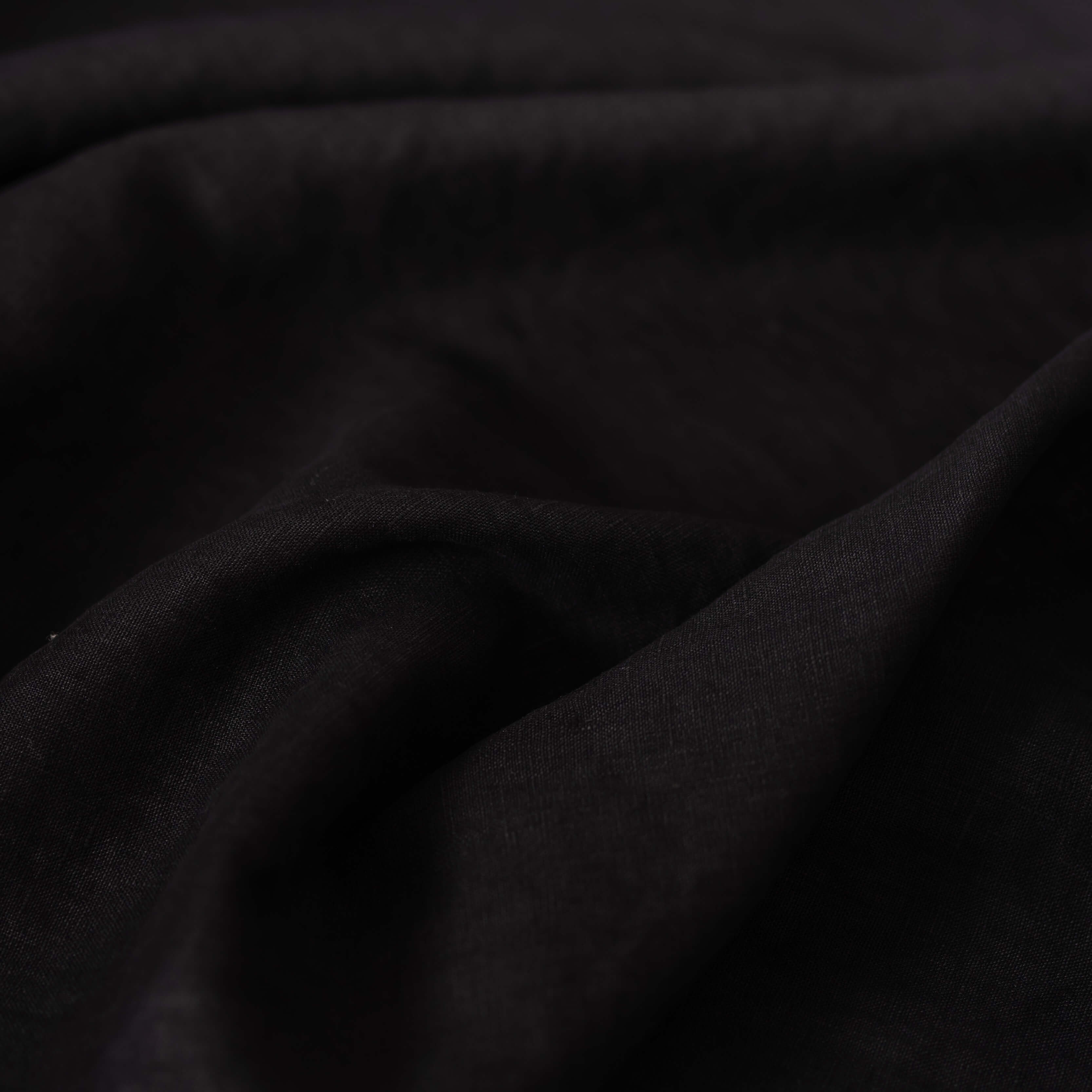 Black linen fabric scrunched up