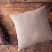 Coconut milk linen cushion cover on wooden table