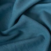 Turquoise Blue linen fabric, crumpled to show its natural texture, washed European flax